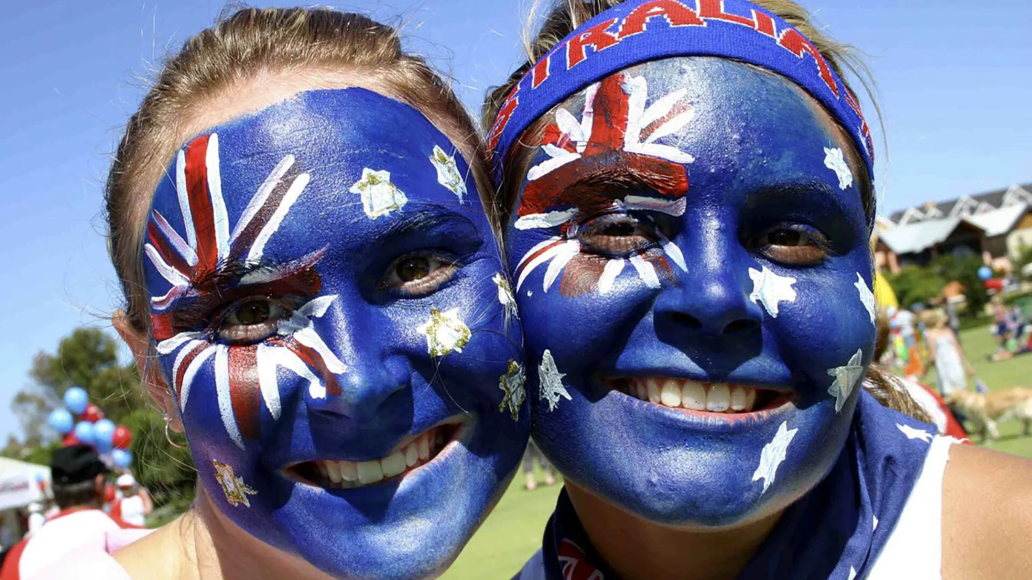 Public festival with Australian flag face paint